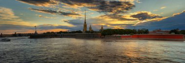 Large-format panorama of the Peter and Paul fortress and the Cathedral at sunset in St. Petersburg clipart
