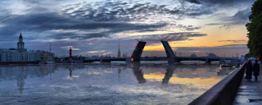 Large-format panorama of the cold dawn over the Neva river and the divorced Palace bridge in St. Petersburg clipart