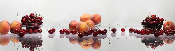 Wide Format Panorama Peaches Cherries White Glossy Table Light Background — Stock Photo, Image