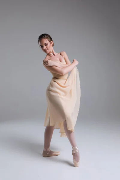 Make dance! Young attractive tender good-looking ballerina with a perfect body smiling, while dancing in the modern studio. — Stock Photo, Image