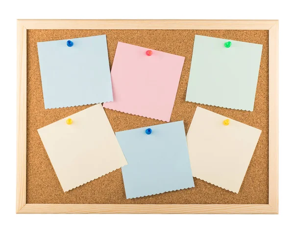 Cork bulletin board with sticky notes