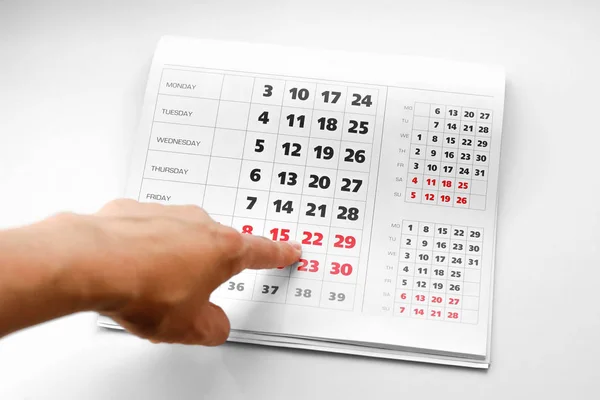 Hand Pointing Calendar White Calendar Weekends Highlighted Red Close — Stock Photo, Image
