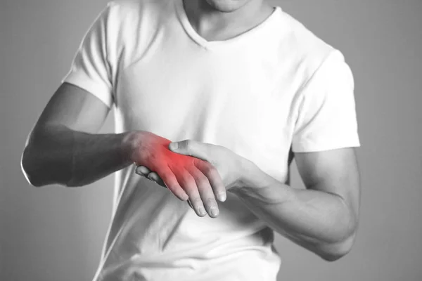 Man Holding Hands Pain Wrist Hearth Highlighted Red Close Isolated — Stock Photo, Image