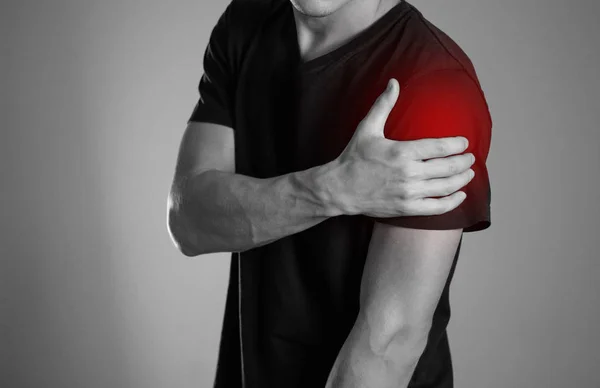 Man Holding Hands Shoulder Pain Hearth Highlighted Red Close Isolated — Stock Photo, Image