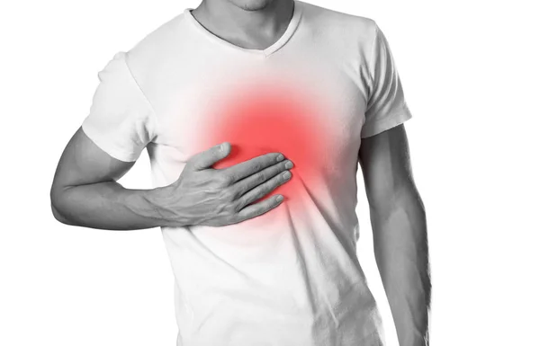 Mannen Håller Bröstet Bröstsmärta Halsbränna Härden Markerade Rött Närbild Isolerad — Stockfoto