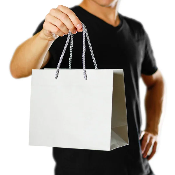 Hombre Sosteniendo Una Bolsa Regalo Gris Cerca Aislado Sobre Fondo —  Fotos de Stock