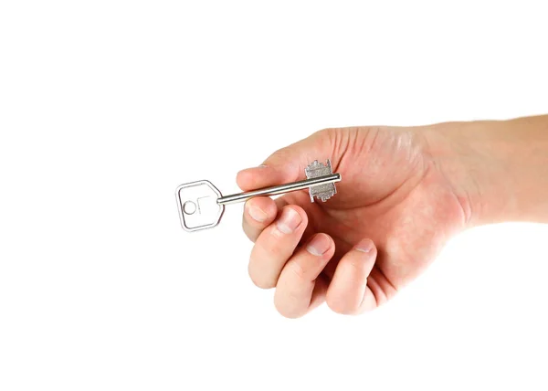 家に鍵を持っている手 クローズ アップ 白い背景に分離 — ストック写真