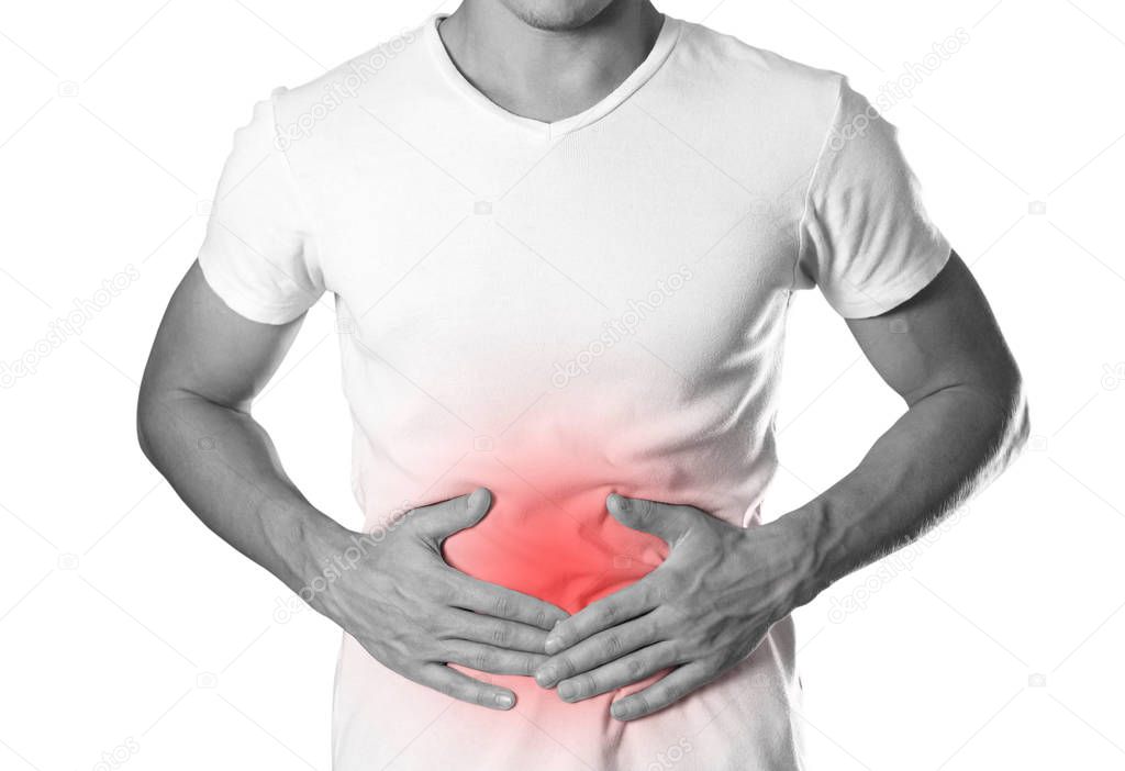 The man is holding his stomach. Abdominal pain. The hearth is highlighted in red. Close up. Isolated on white background.