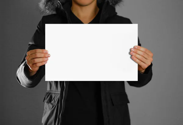 Man showing blank white big A2 paper, covers the face. Leaflet p Stock  Photo by ©onlyblacktv.bk.ru 146433113