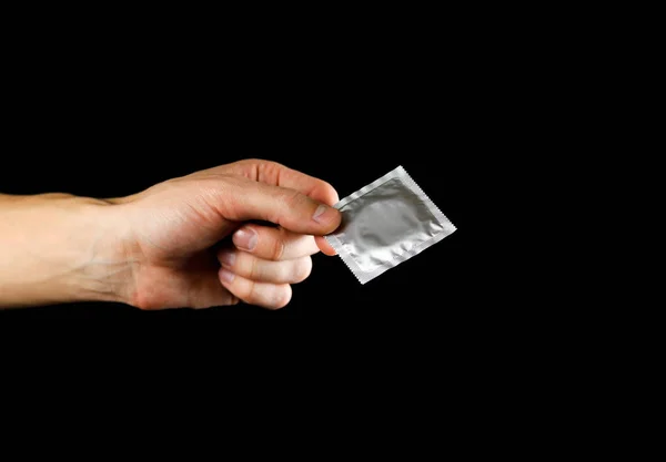 Hand Holding Condom Close Isolated Black Background — Stock Photo, Image