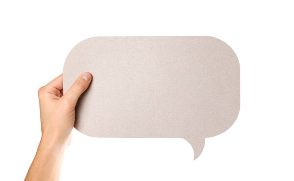 Рука держит пустой пузырь речи. Закрывай. Изолированный на белом фоне
.