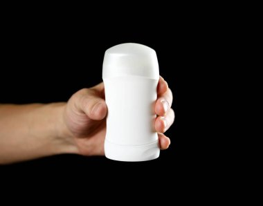 El holding beyaz terlemeyi önleyici. Yakın çekim. Siyah arka plan üzerine izole.