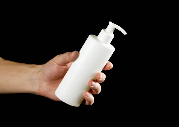 Hand Holding White Bottle Liquid Soap Close Isolated Black Background — Stock Fotó