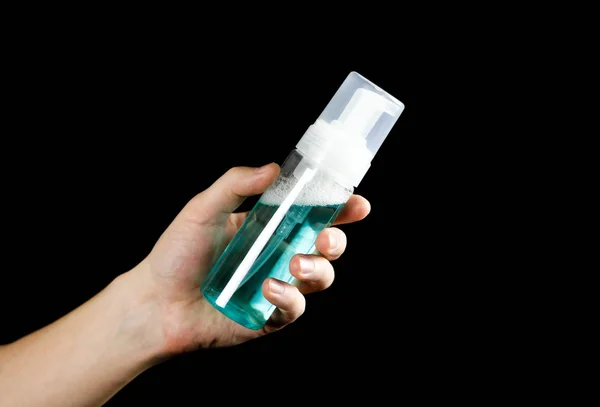 Blue makeup remover. Close up. Isolated on black background.