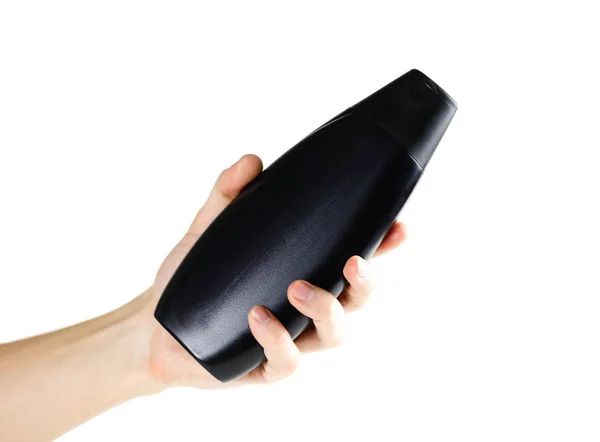 Hand Hält Eine Schwarze Shampoo Flasche Nahaufnahme Isoliert Auf Weißem — Stockfoto