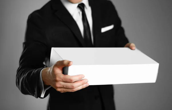 Businessman Black Suit Holding White Box Close Isolated Background — Stock Photo, Image