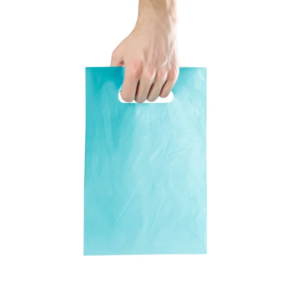 ビニール袋を持つ手 クローズ アップ 白い背景に分離 — ストック写真