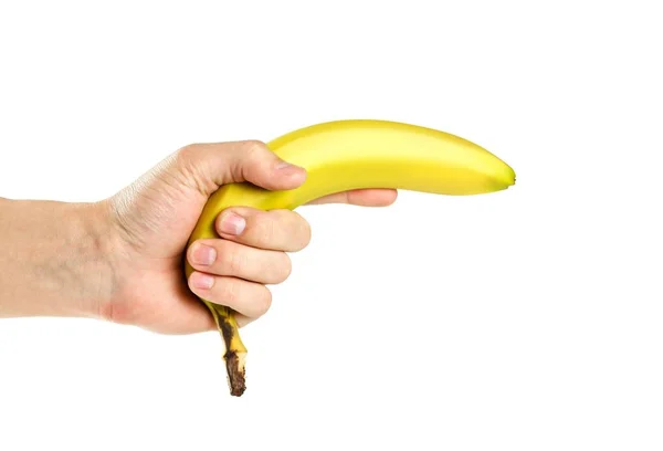 Hand houden van een banaan. Close-up. Geïsoleerd op witte achtergrond — Stockfoto