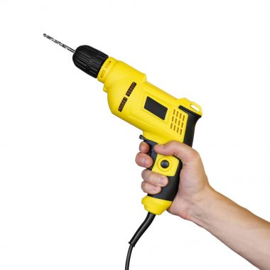 Sarı bir elektrik matkap tutarak el. Kapat şunu. Whit üzerinde izole