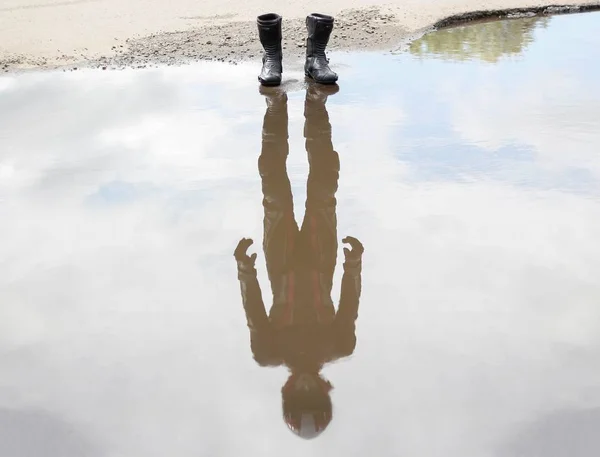 About water are worth moto shoes. In the reflection of the motor Stock Image