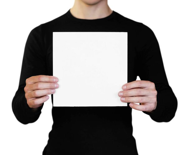 A man holding a white sheet of paper. Holding a booklet. Close u