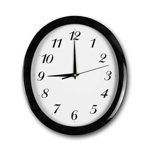 黒いフレームが付いている大きい円形の白い壁の時計。ハンドポイント t — ストック写真