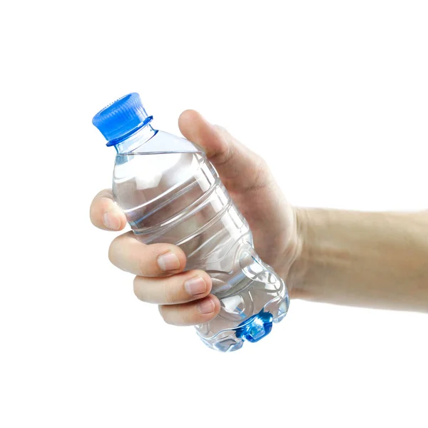 Hand holding a blue bottle of drinking water. Close up. Isolated — Stock Photo, Image