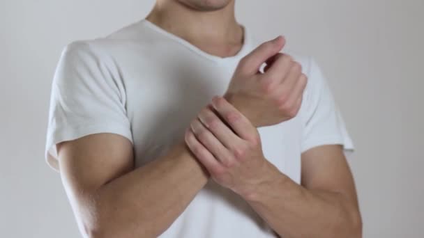 Man Has Sore Arm Pain Arm Close Isolated Gray Background — Stock Video