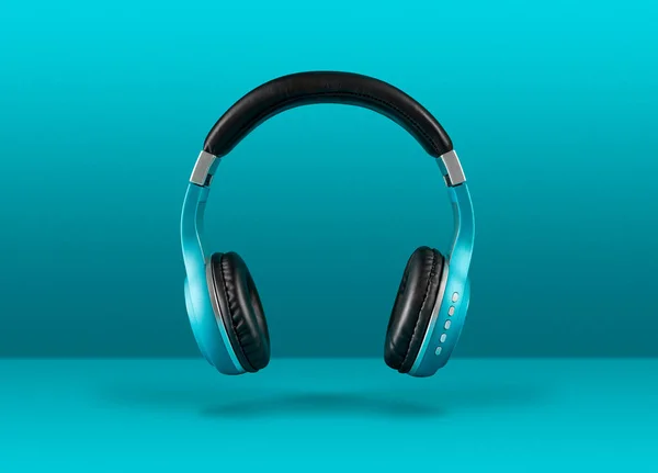 Modern wireless headphones floating over blue background with co — Stock Photo, Image