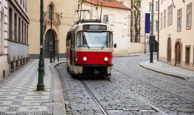 Old fashioned red tram in the city center, Prague clipart