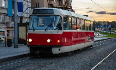 Old fashioned red tram in the evening, Prague clipart