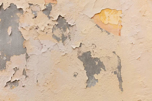 Açık kahverengi renk, duvar boyalı. Yıpranmış ve soluk doku, grunge arka plan. Konut bir binanın dış cephe