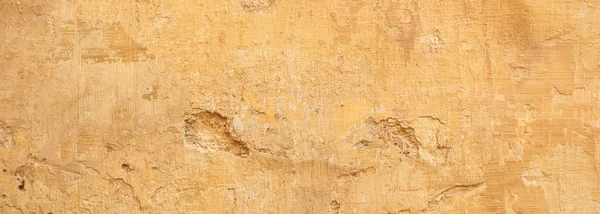 Beige gele kleur, geschilderd en verschoten muur textuur grunge achtergrond — Stockfoto