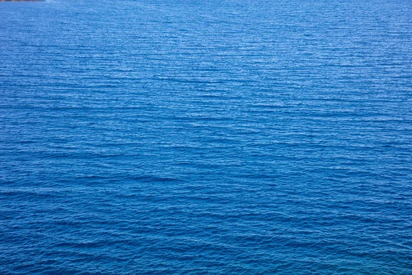 Textura de fondo de agua de mar azul, vista de ángulo alto — Foto de Stock