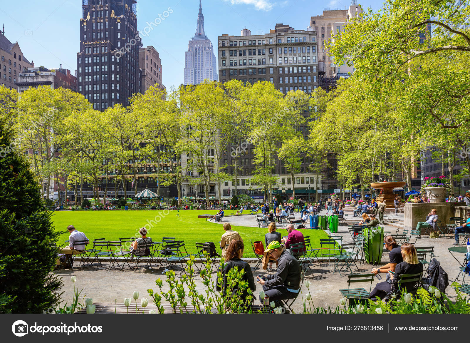 Bryant park, New York, Manhattan. People relaxing, sunny day in spring 