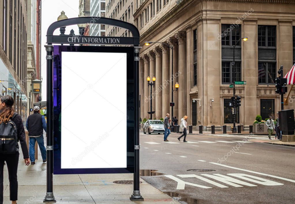 Blank billboard at bus stop for advertising, Chicago city buildings and street background