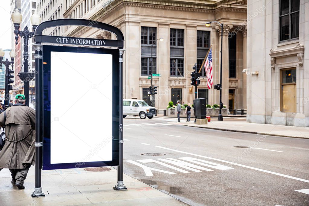 Blank billboard at bus stop for advertising, Chicago city buildings and street background