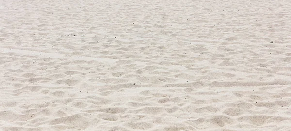 Praia de areia fundo textura vazia. Dia ensolarado da primavera — Fotografia de Stock