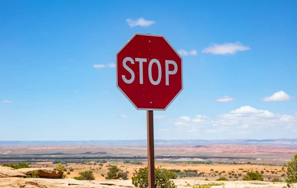 Stop road sign against blue sky background. Sunny spring day in western USA countryside — Stock Photo, Image