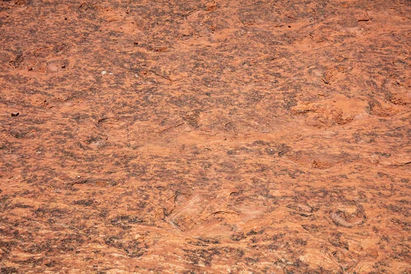 Red sandstone desert rock background, texture.