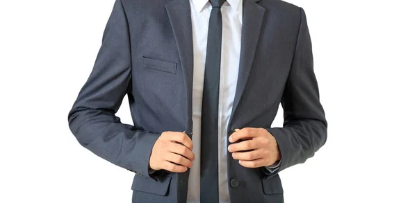 Young businessman in gray suit isolated against white background. — Stock Photo, Image