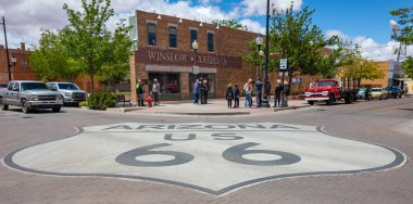 Historic route 66 sign on the street, Winslow Arizona, USA. clipart