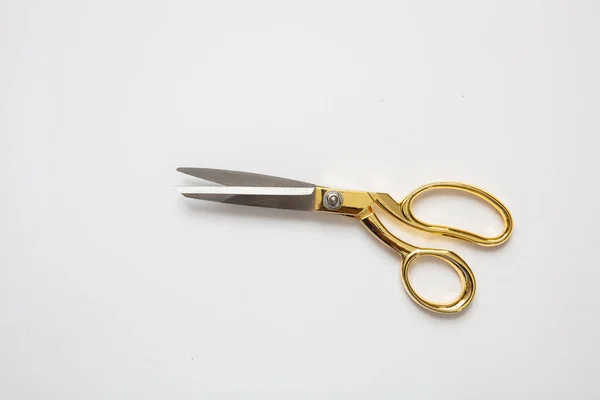 Scissors gold and silver isolated against white background — Stock Photo, Image