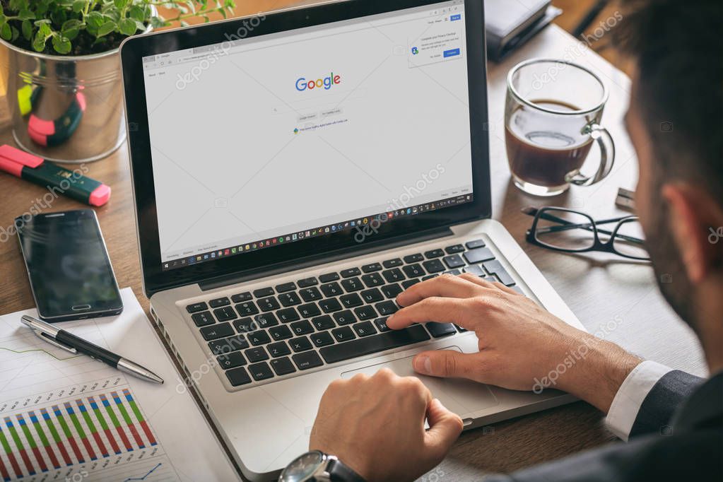 Athens, Greece. September 18, 2019. Young man working with a laptop, Google search engine on the computer screen, office workspace