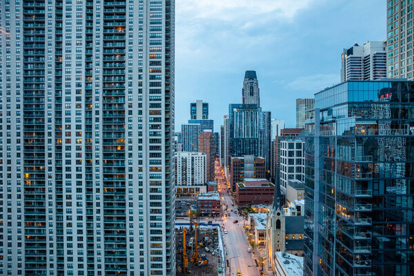Chicago, Illinois, USA, May 9, 2019. Above view of skyscrapers in Chicago. Glass buildings reflecting the lights of the highway in the evening.