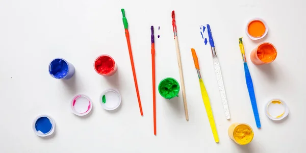 Colorful finger paints set on white color background, top view — Stock Photo, Image