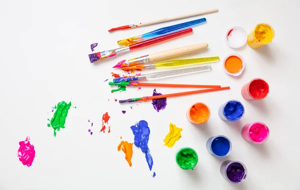 Colorful finger paints set on white color background, top view — Stock Photo, Image