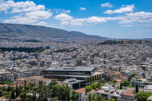 Athens Acropolis museum, exhibits the findings of the Acropolis archaeological site and cityscape in a sunny spring day. View from Acropolis hill. Attica, Greece