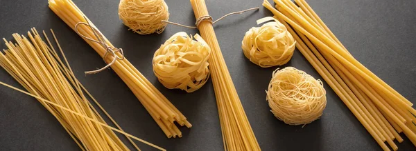 Pasta Cooking Concept Raw Pasta Spaghetti Noodles Variety Black Background — Stock Photo, Image