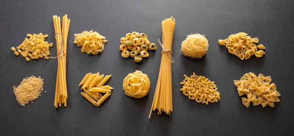 Pasta Cooking Concept Raw Pasta Shapes Variety Flat Lay Black — Stock Photo, Image